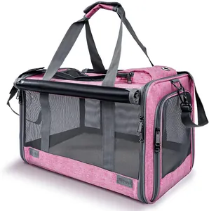 Detail view of a pink breathable pet carrier for small dogs and cats with mesh windows.