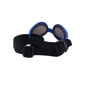 Detail view of the adjustable black elastic strap on blue pet protective goggles.
