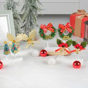 Assorted mini Christmas cake toppers including wreaths, trees and holly leaves decoration