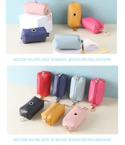 Colorful portable pet waste bag dispensers with bottom velcro and buckle for leash attachment.