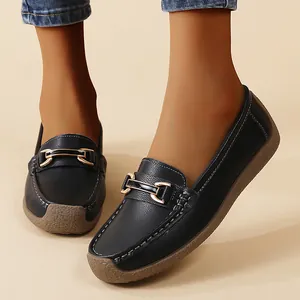 Comfortable black women's casual loafers with soft sole and gold buckle detail.