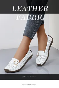 White perforated leather loafers for women with comfortable soft sole and floral cut-outs