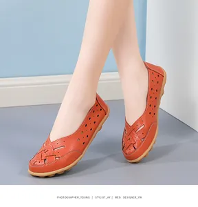 Detail showing women's orange hollow-out leather loafers with non-slip gum sole