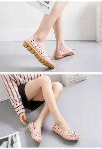Detailed view of pink hollow-out loafers featuring a comfortable knobby massage sole.