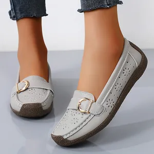 Comfortable light gray perforated women's loafers with gold buckle and soft sole