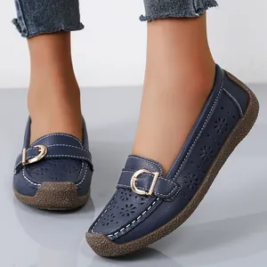 Comfortable navy blue laser-cut loafers with soft soles and gold buckle for women
