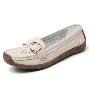 Elegant beige perforated loafers for women with soft flat sole and floral cut-outs