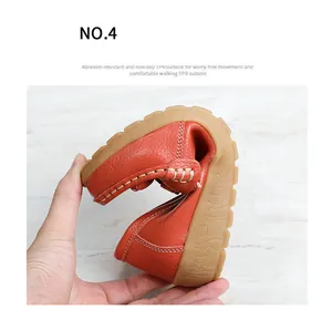 Detail showing the flexibility of orange leather loafers with non-slip TPR outsole