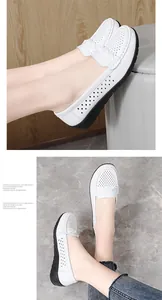 Macro detail view of white hollow-out leather loafers showing woven texture and comfort