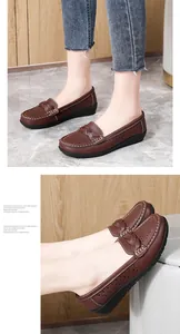 Detailed view of brown casual flats with perforated leather and braided vamp detail