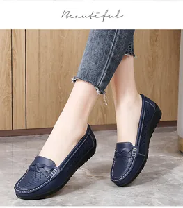 Close-up of navy blue breathable leather loafers with braided strap detail
