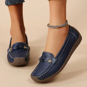 Comfortable navy blue slip-on loafers for women with soft soles and decorative stitching