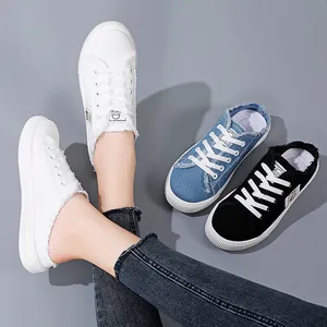 Women's casual canvas backless mule sneakers available in white, blue and black.