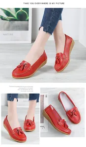 Comfortable red leather loafers for women featuring elegant tassels and horsebit buckle