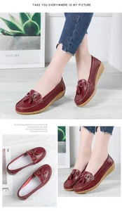 Elegant wine red leather loafers featuring tassel detail and a soft comfort wedge sole