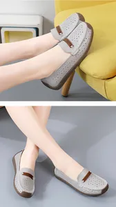 Gedetailleerd overzicht van grijze lasergesneden leren loafers voor dames met ademend ontwerp