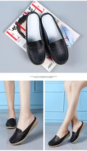Dettaglio delle scarpe sabot nere traspiranti con zeppa e fori traforati