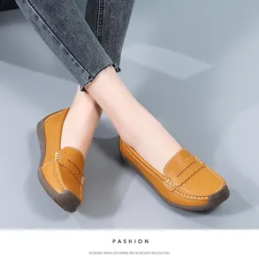 Comfortable yellow leather loafers for women with thick rubber soles and hand stitching