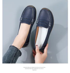 Close-up of blue leather loafers with contrast stitching and comfortable sole