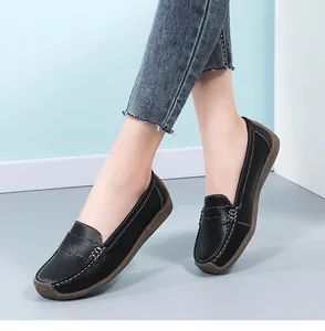Elegant black leather loafer shoes for women with stylish white stitching details and rubber sole