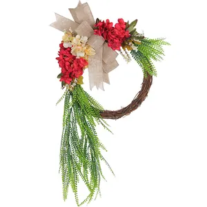 Rustic farmhouse wreath with red flowers and burlap bow for front door decor