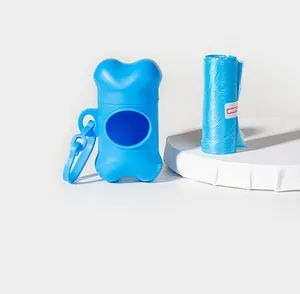Blue bone-shaped dog poop bag dispenser and refill roll presented on a white stand.