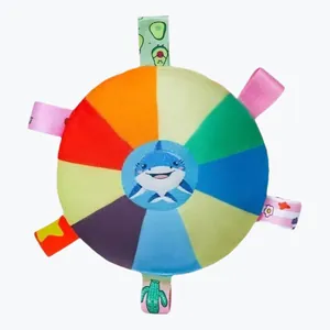 Detailed top view of colorful plush dog flying disc with shark pattern and fabric tabs