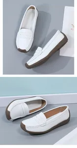 Detail view of comfortable white leather loafers with durable brown rubber soles