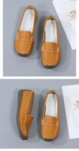 Comfortable mustard yellow leather loafers with white stitching and non-slip rubber sole.
