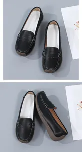 Detail view of black leather loafers with white stitching and durable gum sole.