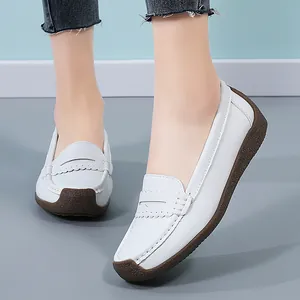 Comfortable women's white leather loafers with durable gum sole for daily wear