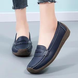 Comfortable navy blue leather loafers with white contrast stitching and durable rubber soles