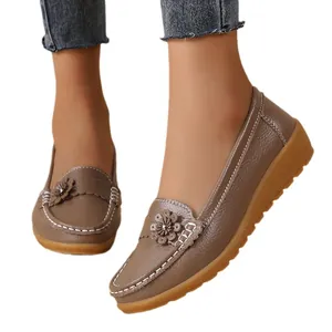 Comfortable taupe women's loafers with decorative flower and textured leather finish