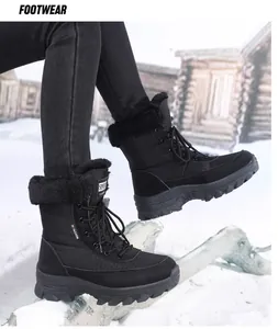 Women's black lace-up snow boots with thick faux fur lining for winter outdoors