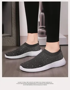 Close-up of women's charcoal grey rhinestone elastic knit sock sneakers with white MD sole