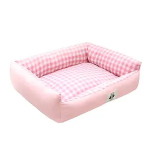 Soft pink and white checkered plush pet bed for small to medium dogs and indoor cats