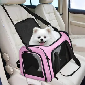 Pink portable pet carrier bag secured on a white car seat with a small white dog inside
