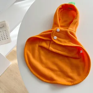Detailed view of soft orange fleece pumpkin pet cape with green stem hood for Halloween