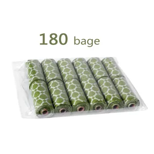 Detailed view of 6 rolls of green patterned dog poop bags in transparent packaging