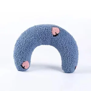 Soft blue U-shaped dog plush squeaky toy with cute pink paw prints for interactive play