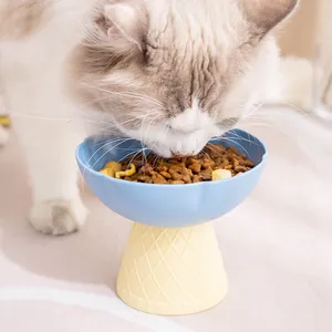 Elevated cat bowl featuring a cute ice cream cone base for neck protection and feeding