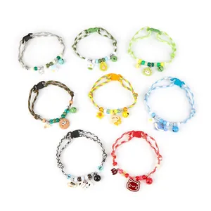 Collection of eight colorful cartoon pet collars with bells and cute charms on white background