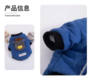 Detailed view of a blue quilted dog vest with a reindeer patch and fleece lining