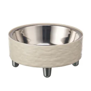 Elevated stainless steel pet bowl with cream textured outer for cat and dog feeding