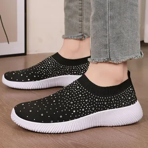 Breathable black fly-weave sock shoes for women with sparkling rhinestones and MD sole.
