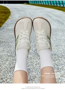 Top view of retro German army trainer sneakers featuring mesh and leather textures.