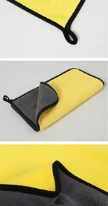 Detailed close-up of yellow and grey microfiber absorbent pet towel with hanging loop