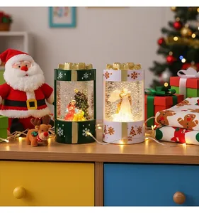 Glowing Christmas gift box snow globe lanterns with nativity and angel festive scenes