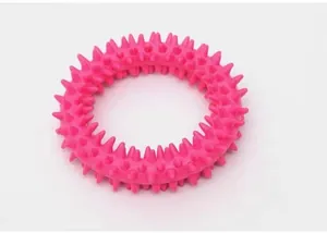 Detailed close-up view of a pink TPR spiked dog ring toy for teeth cleaning and training