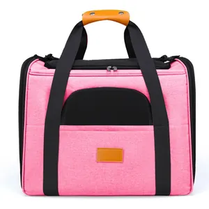 Close-up of a pink foldable pet carrier bag with breathable black mesh windows